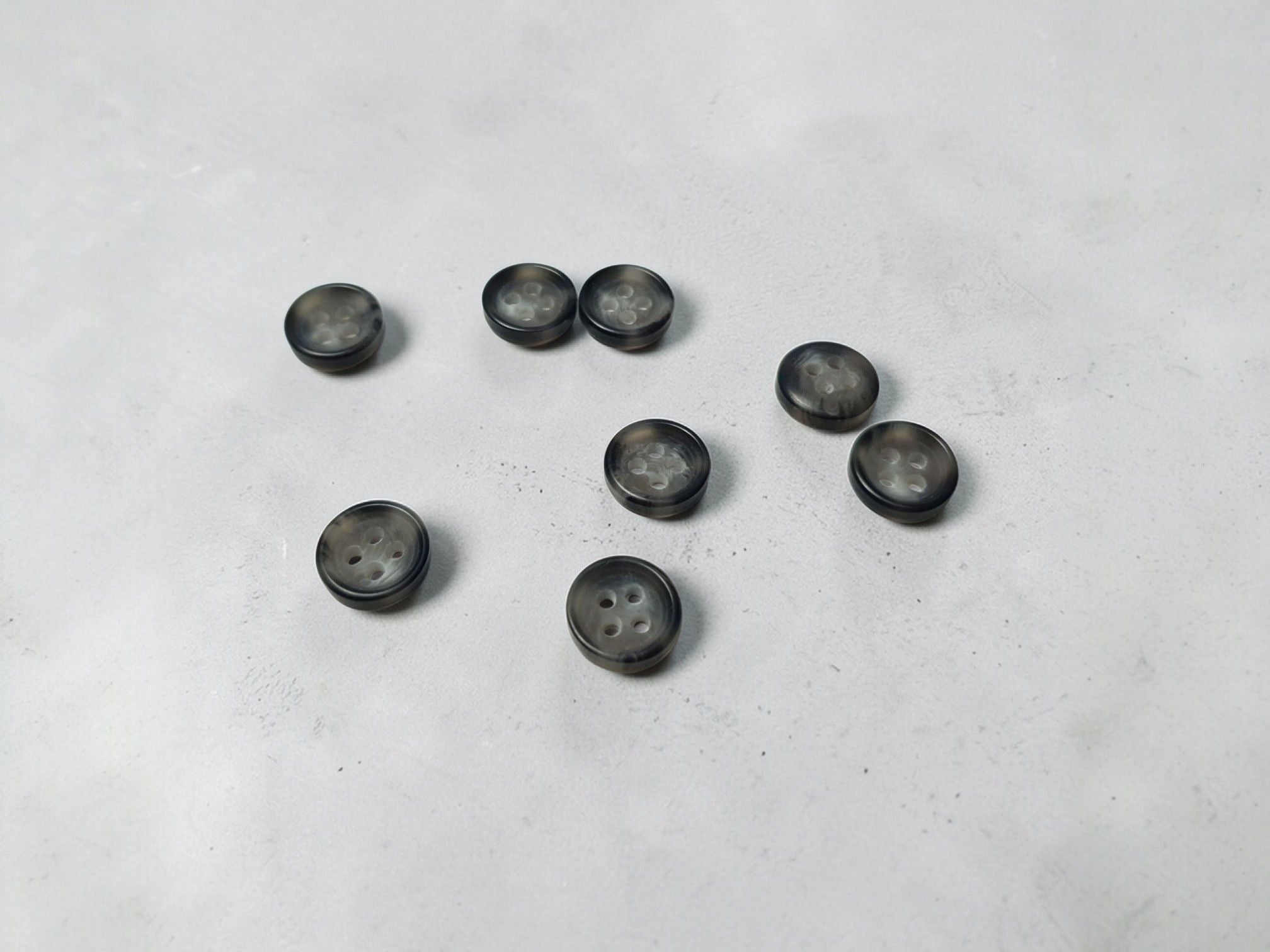 Kunststoffknöpfe mit Rand 10mm grau melange