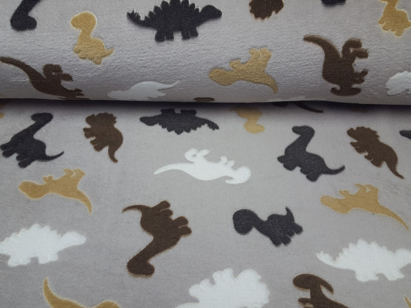 Wellnessfleece Dino sand/weiss/braun