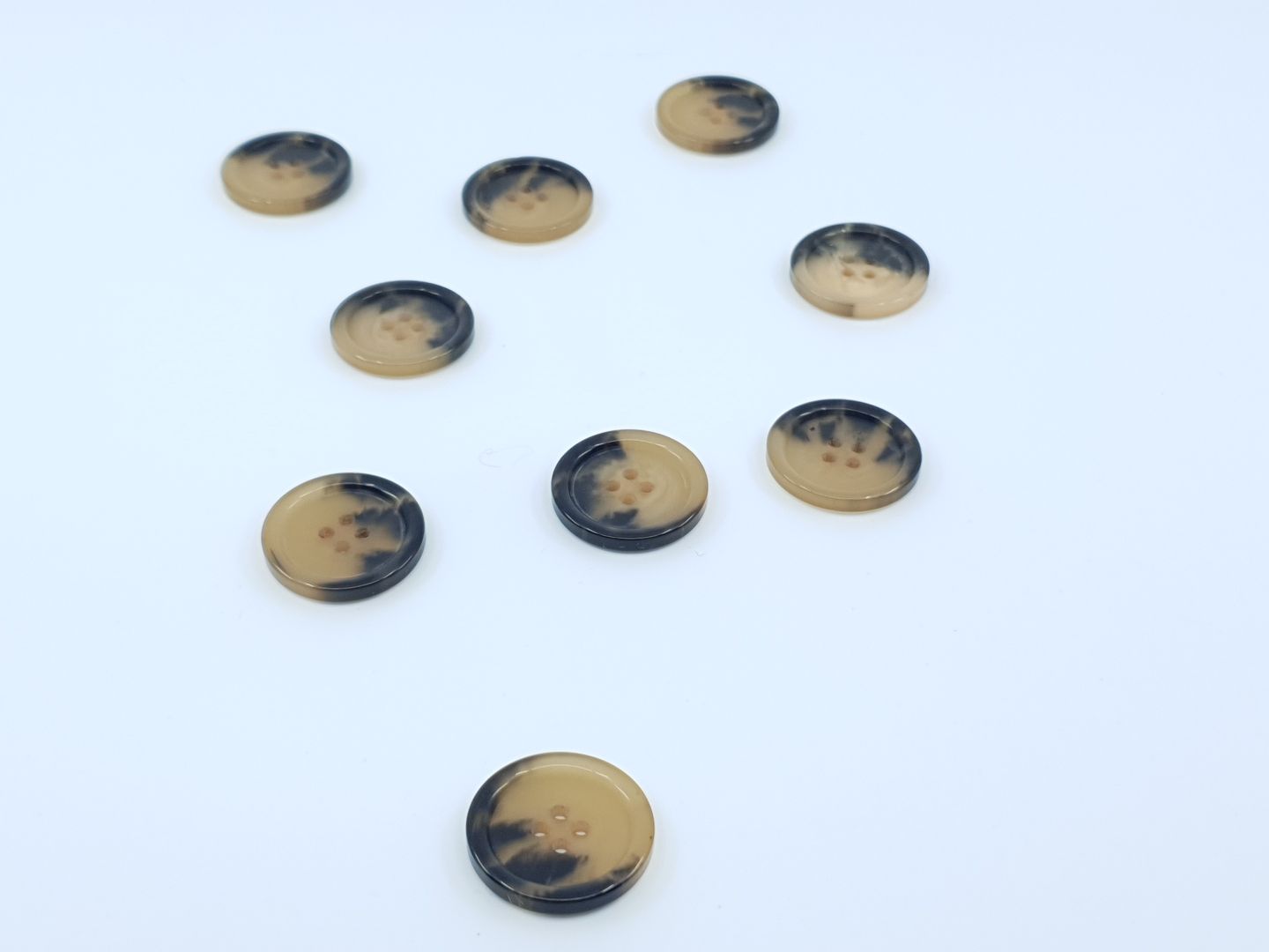 Kunststoffknöpfe 25mm hellbraun melange
