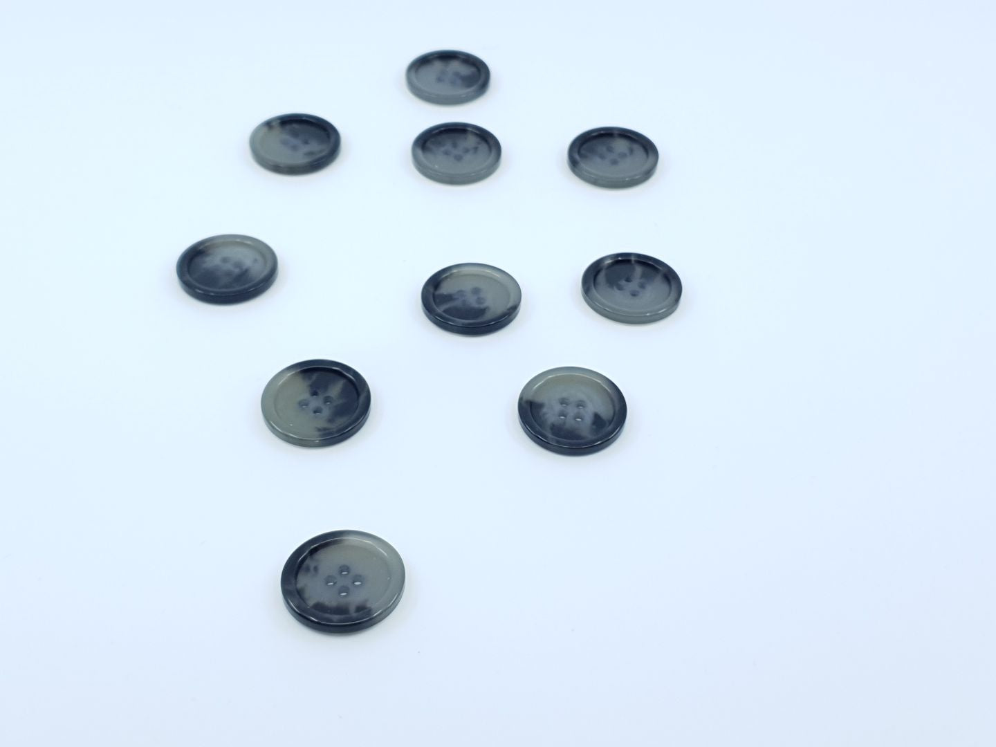 Kunststoffknöpfe 25mm hellgrau/schwarz