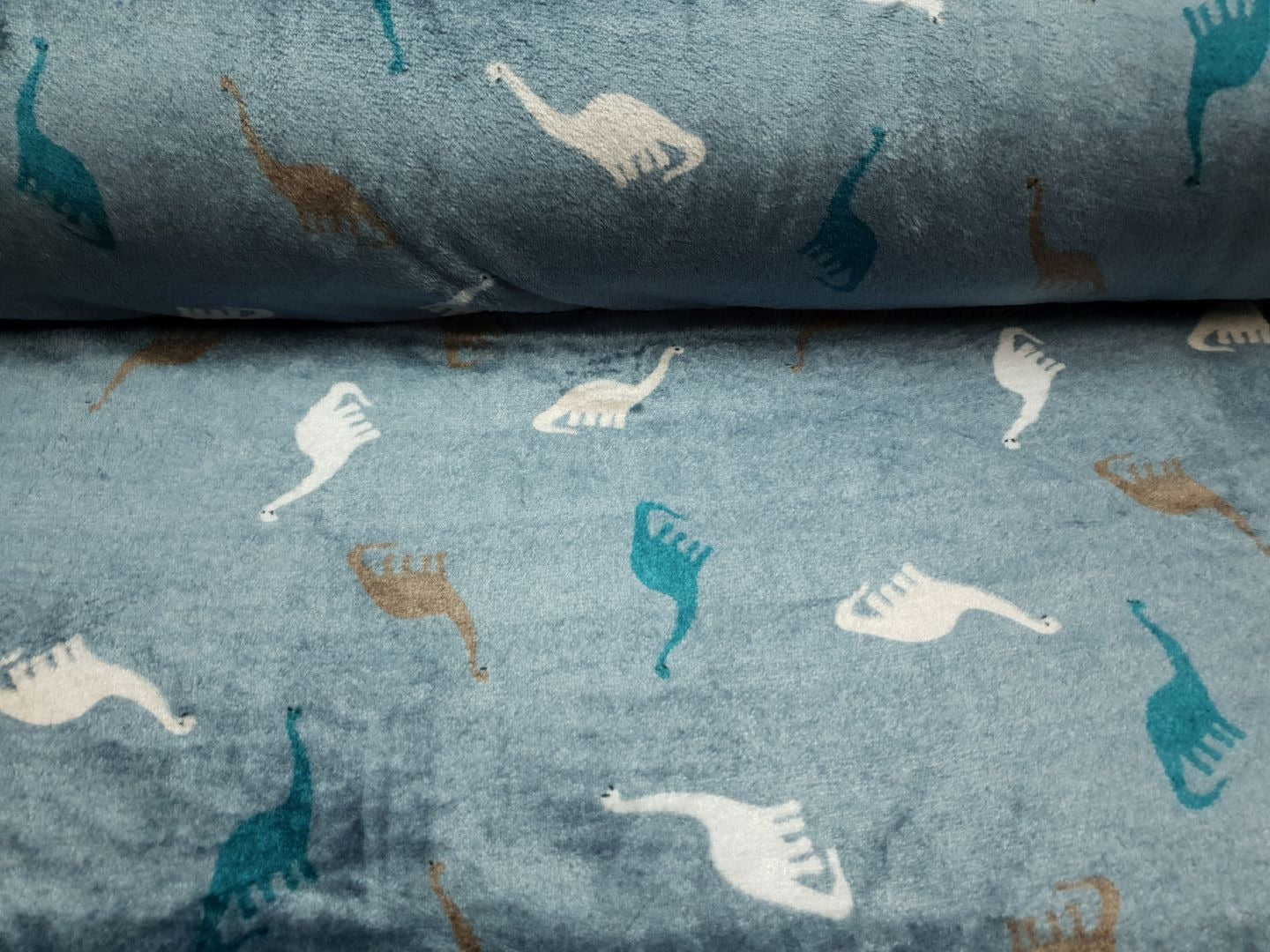Wellnessfleece Dinos stahlblau/petrol/offwhite/braun